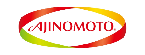 Logo AJINOMOTO menonjolkan tulisan berwarna merah dengan elemen melingkar berwarna hijau, kuning, dan oranye, menciptakan identitas merek yang dinamis dalam industri makanan.